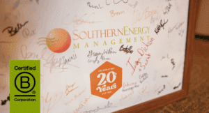 A poster showing Southern Energy Management's logo with a 20+ year badge and team member signatures