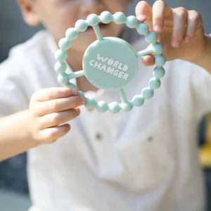 Light blue teething ring that says World Changer from Bella Tunno