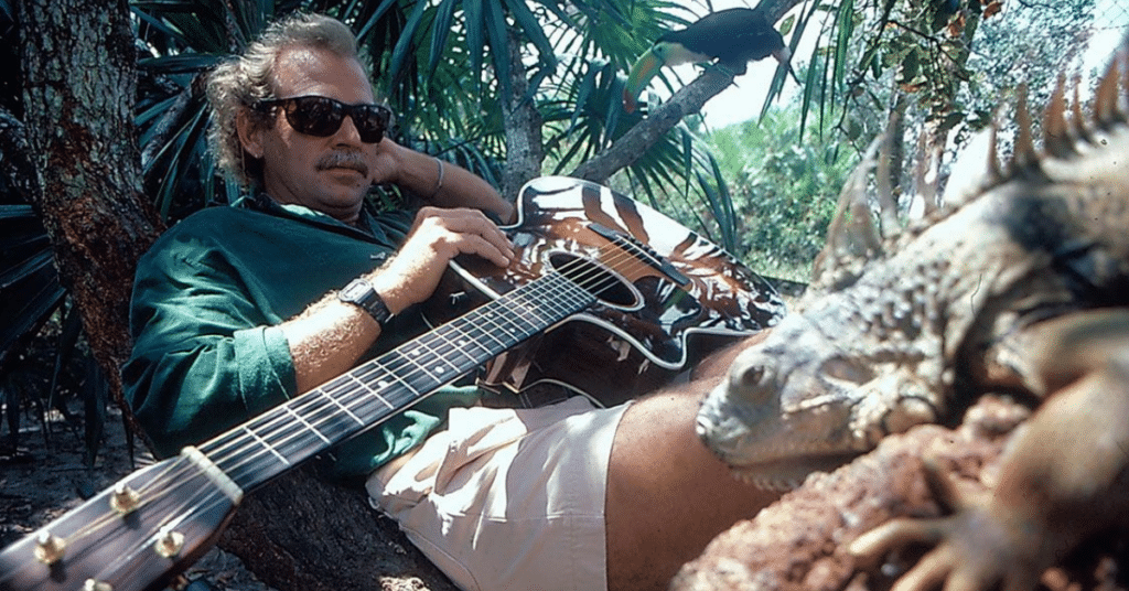 Jimmy Buffett chillin with his guitar and an iguana