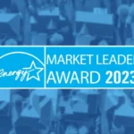 Market leader award logo over top of a blurred neighborhood aerial photo