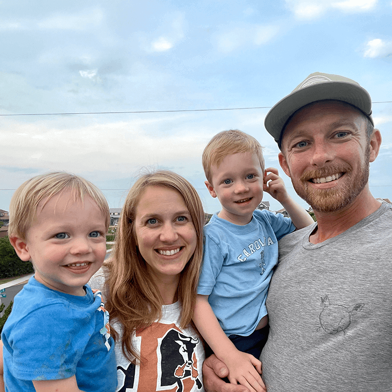 Taylor Fearrington with his family on a blue sky day