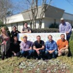 Co-Founders Bob and Maria Kingery stand outside Southern Energy Management's headquarters with the new ownership team