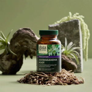 Bottle of Ashwagandha supplements from Gaia Herbs surrounded by natural elements