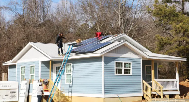 Southern Energy Management solar technicians installing a solar system on a Habitat for Humanity Home