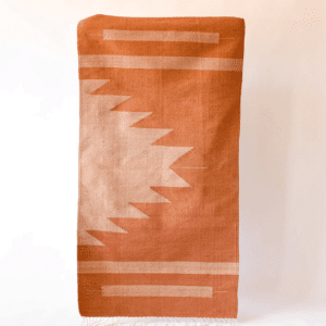 An orange and salmon modern woven geometric rug from Loom Imports