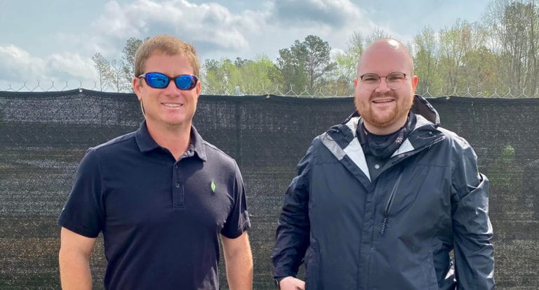 Spring Shine On Champion, Mark Watson, from New Leaf Builders standing next to Building Performance Technician, Richard Bohlen, from Southern Energy Management