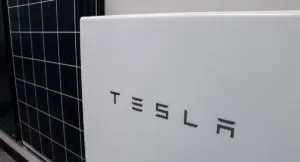 Tesla Powerwall next to poly solar pv panel