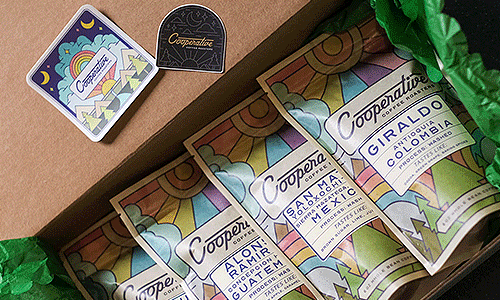 A tasting box from Cooperative coffee featuring several pouches of coffee samples