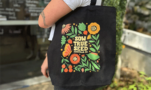 Black market tote bag with colorful floral design from SowTrue Seed