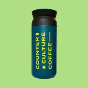 Teal tumbler with yellow counter culture branding