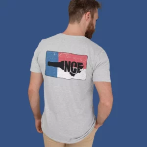 Person wearing grey screenprinted shirt with red white and blue NC beer design from TS Designs