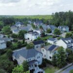 Drone shot of a neighborhood with multiple solar installs