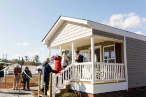 Visitors checking out the model home at Eden Village during the grand opening