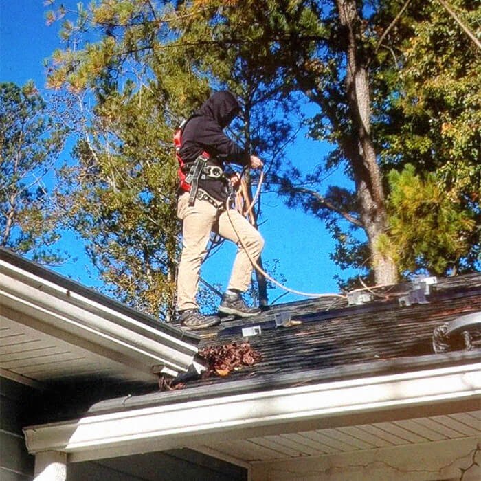 Solar installer working on roof