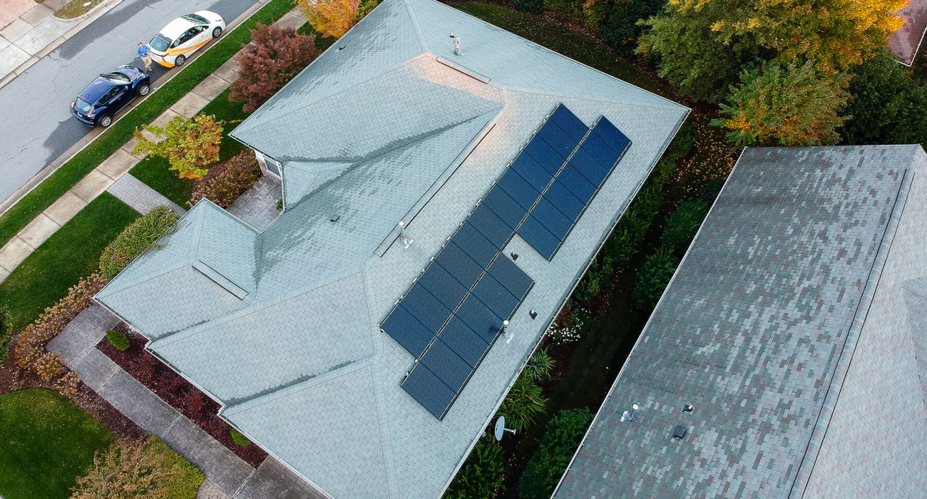 Aerial view of a home with mono-panel solar