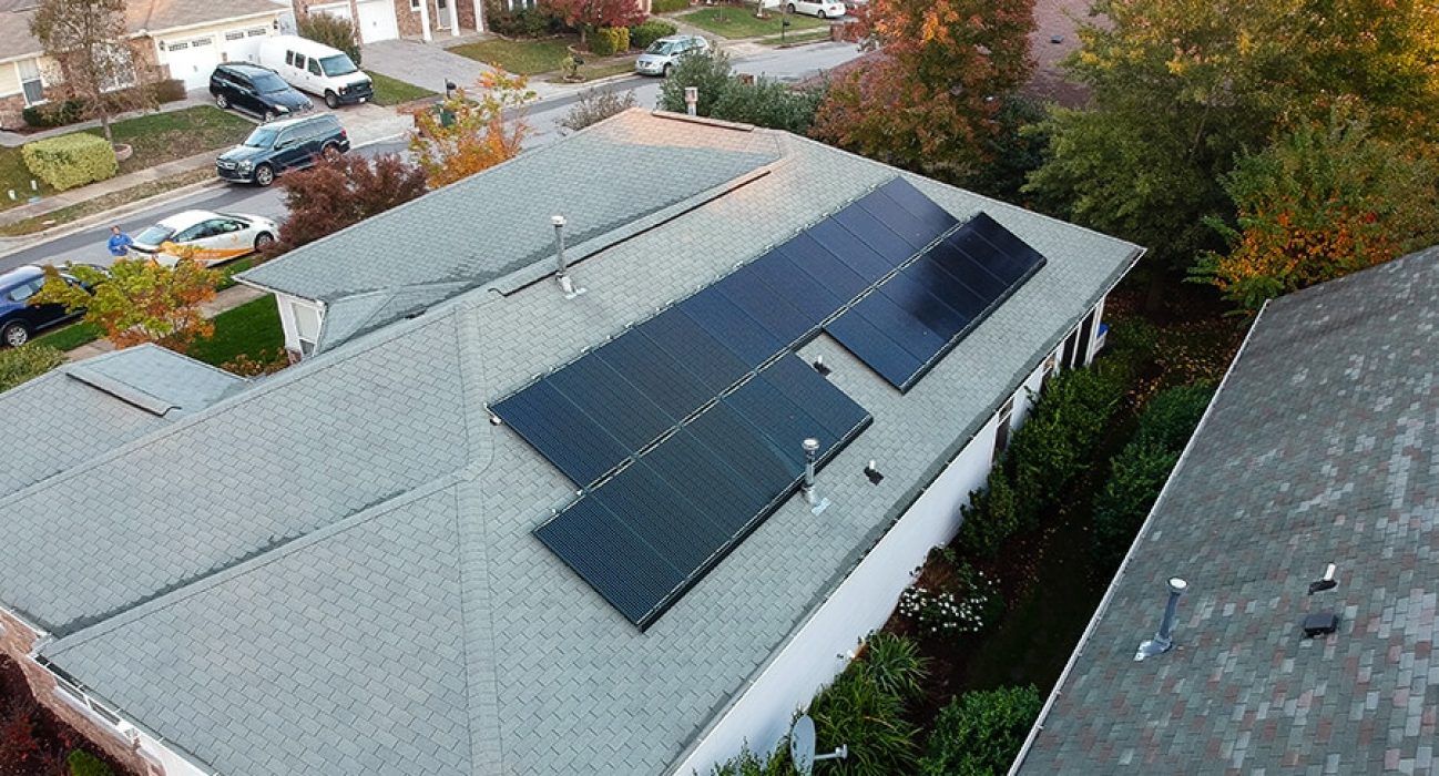 Black solar panel array on a home with a gray roof