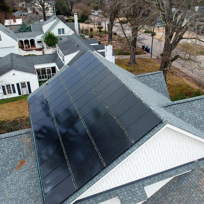 Aerial view of a monochrome roof mounted solar system