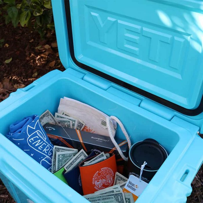 The inside of SEM's Yeti Cash Cooler Award, filled with cash and swag