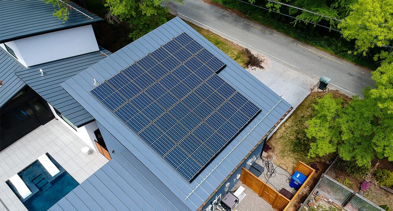 Poly panel solar system installed on a blue metal roof