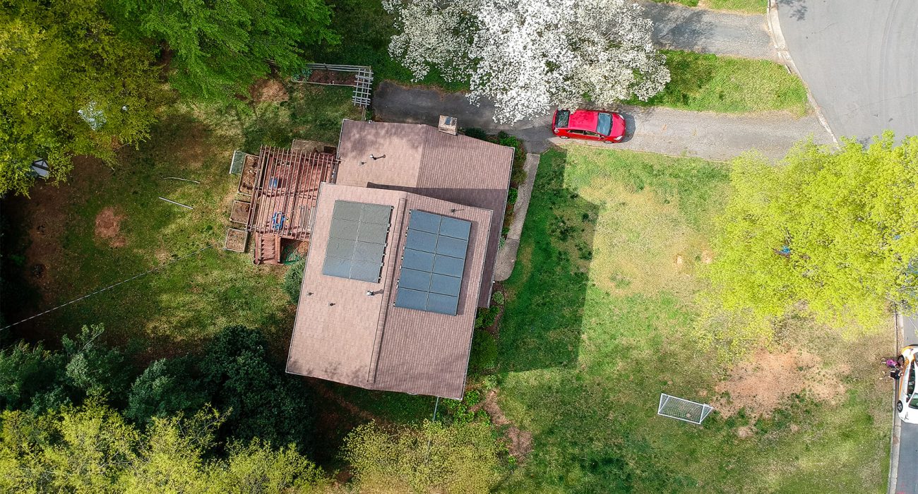 Aerial view of a solar system on a brown roof