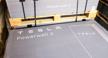 Tesla Powerwall 2 in gray box