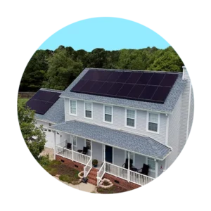 Two story blue traditional home with solar panels on the roof and trees in the background in a blue graphic circle