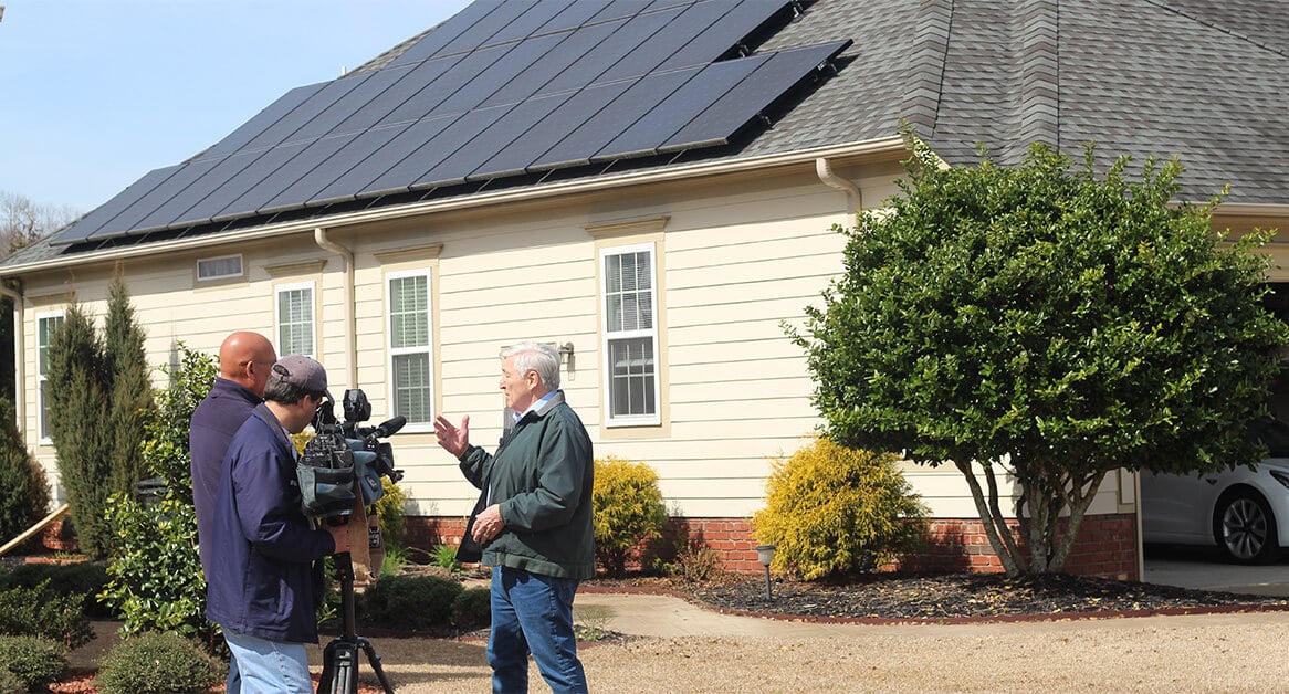 home solar panel owner being interview by WRAL