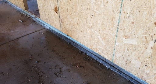 Slab insulation installed between conditioned space and garage