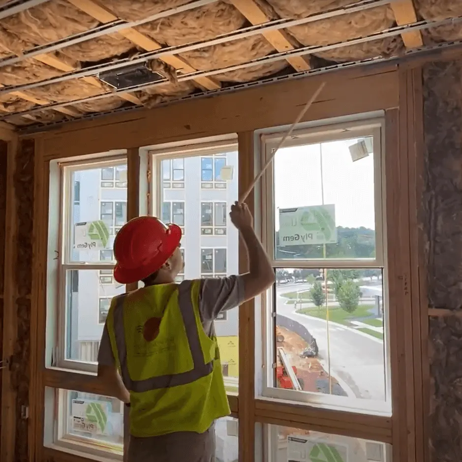 Multifamily services team inspects building performance on site during construction