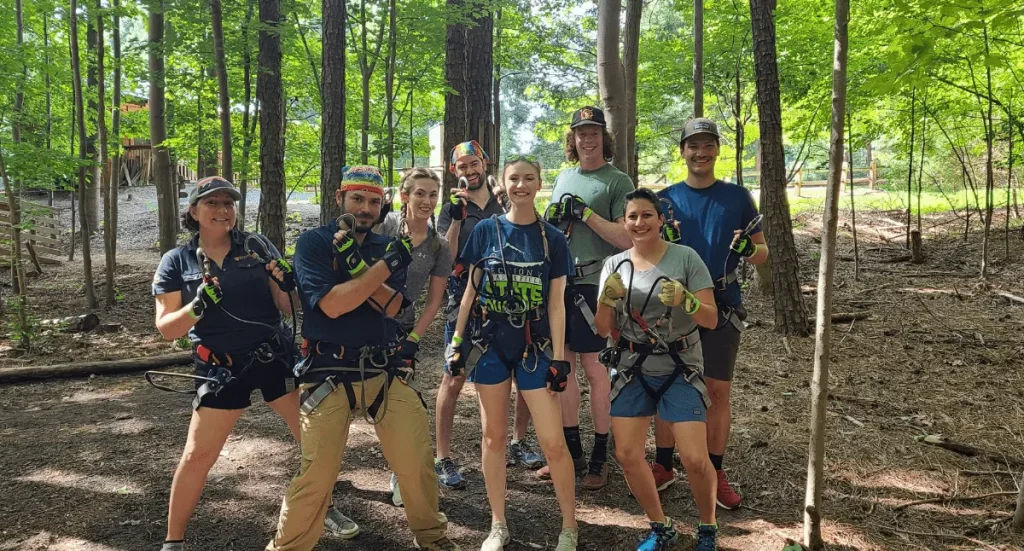 Group of multifamily efficiency verifiers during a team outing in the woods