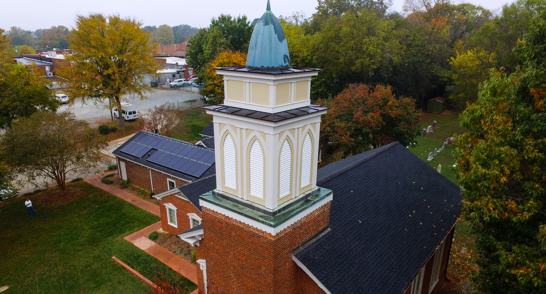 View of historic Pittsboro Presbyterian Church's steeple and solar system
