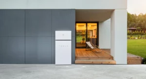 a tesla powerwall+ system installed on the exterior of a modern, contemporary home