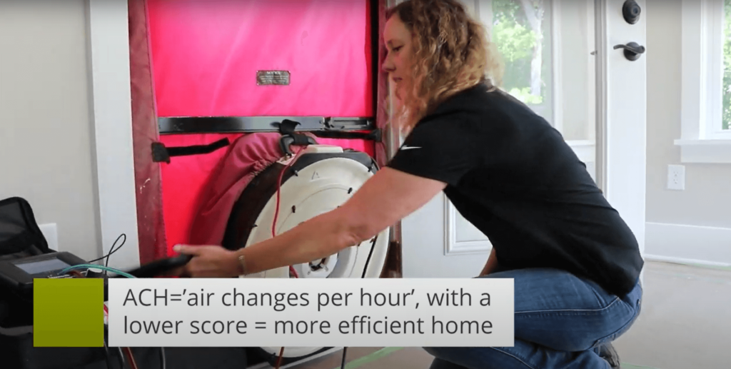 Sara demonstrates a blower door test to measure home efficiency