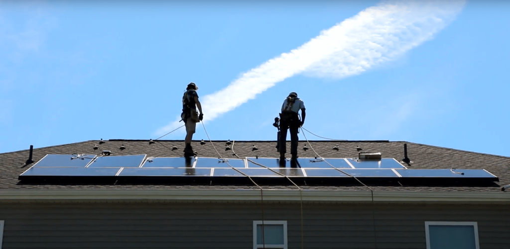 Southern Energy Management solar team installing panels on a roof