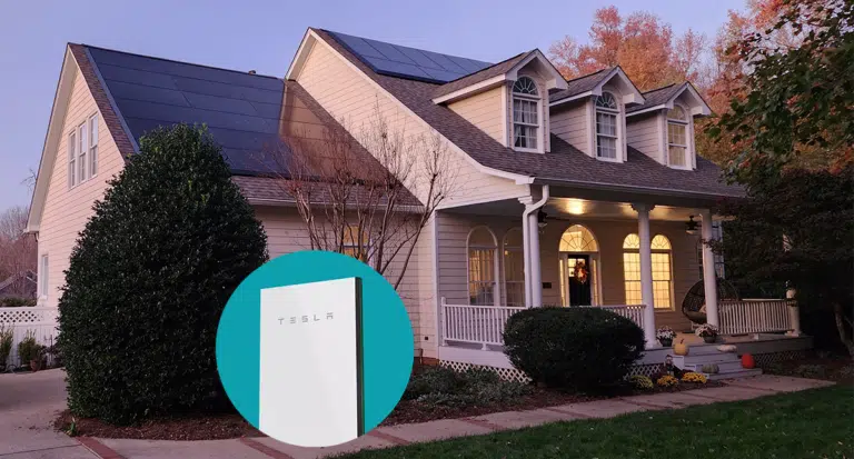 house with a sunset and graphic of a tesla powerwall
