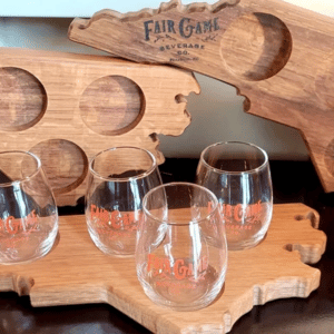 Handcrafted wood beer flight board in the shape of NCwith tasting glasses from Fair Game