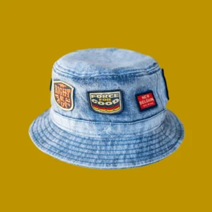 Denim bucket hat with patches on a goldenrod background from New Belgium