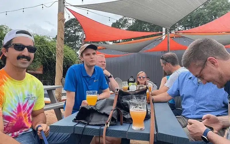 Solar team from southern energy mangaement having drinks together outside at gizmo